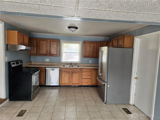 kitchen with sink, light tile patterned floors, ornamental molding, and appliances with stainless steel finishes