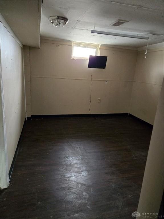 basement with dark wood-type flooring