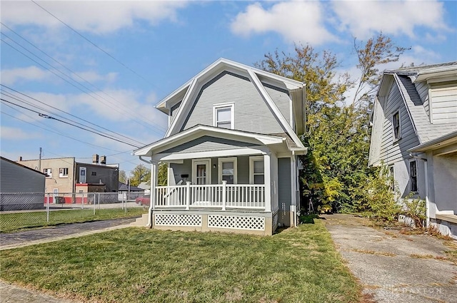 view of front facade featuring a porch and a front lawn