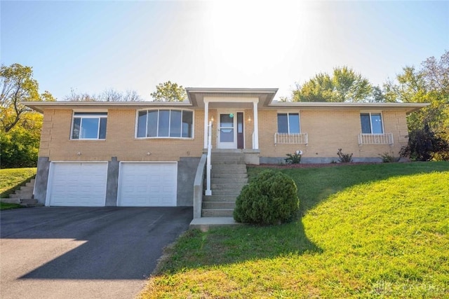 view of front of home featuring a garage and a front yard