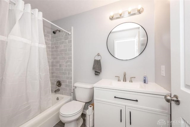 full bathroom featuring shower / tub combo, vanity, and toilet