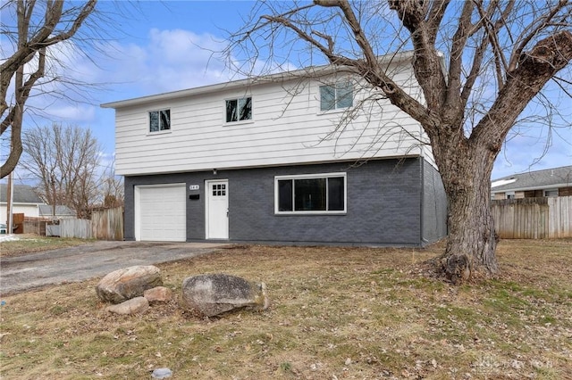 rear view of house with a garage