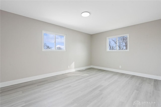 unfurnished room featuring light hardwood / wood-style flooring