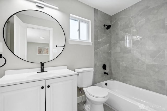 full bathroom with tiled shower / bath combo, vanity, and toilet