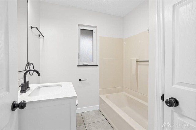 full bathroom with tile patterned floors, toilet, a textured ceiling, vanity, and shower / bath combination