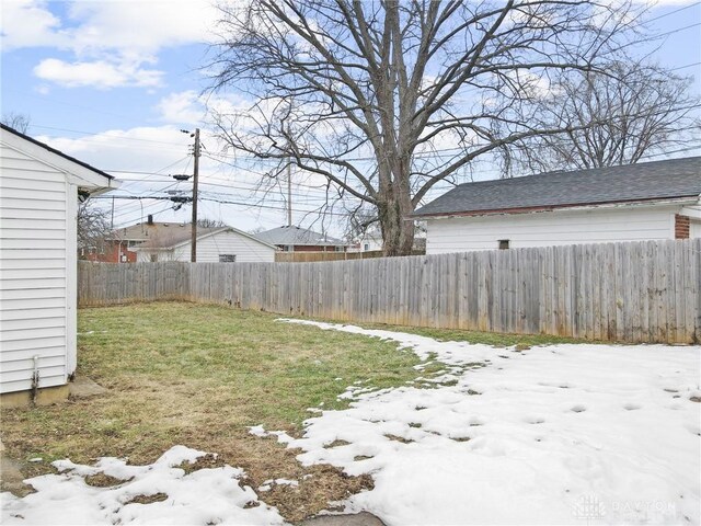 view of yard layered in snow