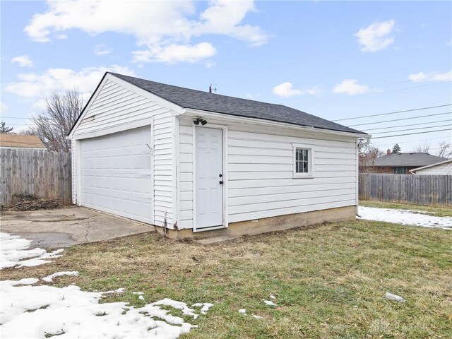 garage featuring a yard