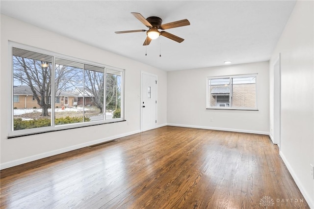 spare room featuring ceiling fan and hardwood / wood-style floors