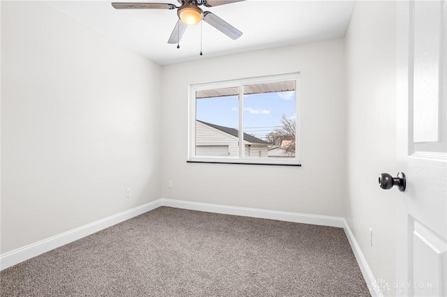 spare room with ceiling fan and carpet flooring