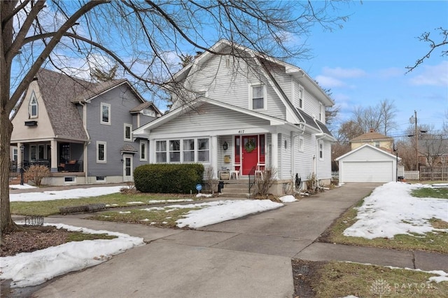 front facade with a garage and an outdoor structure