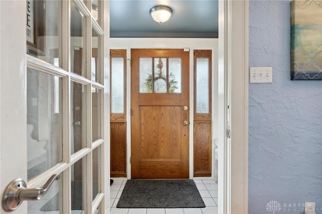 entryway featuring light tile patterned flooring