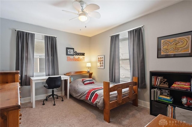 carpeted bedroom featuring ceiling fan