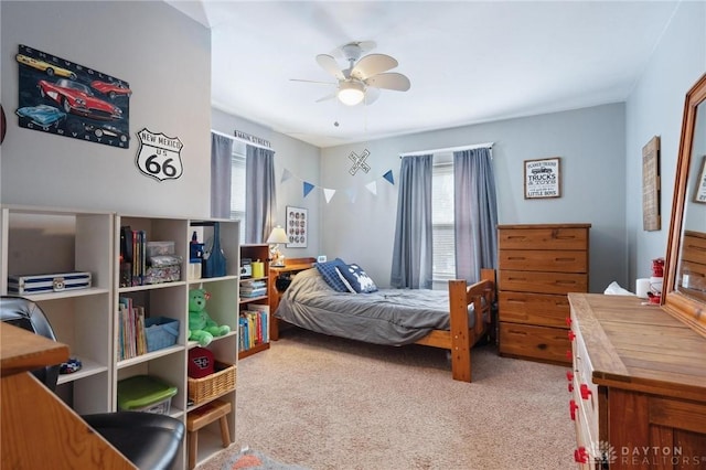 carpeted bedroom with ceiling fan