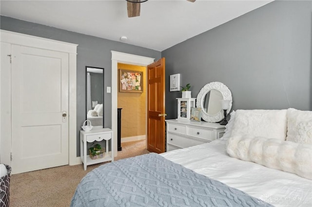 bedroom with light carpet and ceiling fan