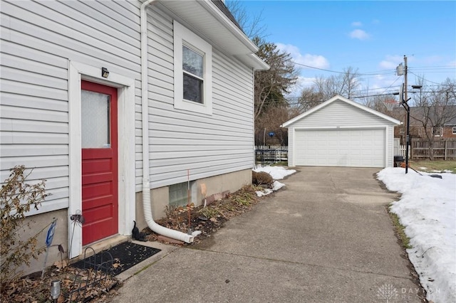 view of side of home featuring an outbuilding and a garage