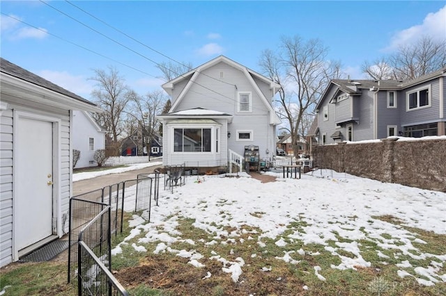 view of snow covered house