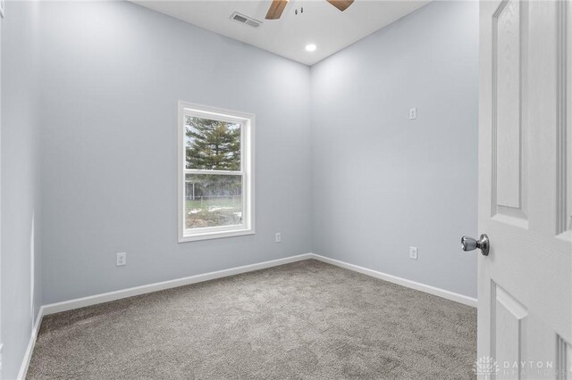 spare room with ceiling fan and carpet flooring