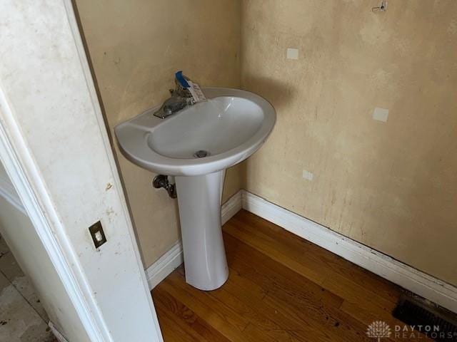 bathroom featuring hardwood / wood-style flooring