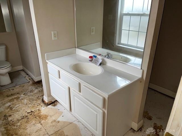 bathroom with vanity and toilet