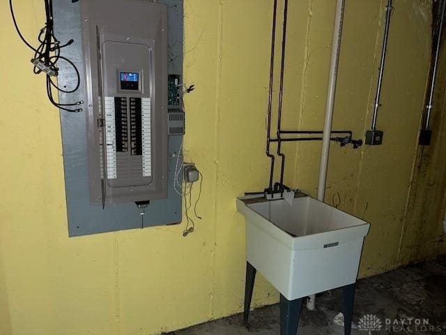 utilities with electric panel and sink