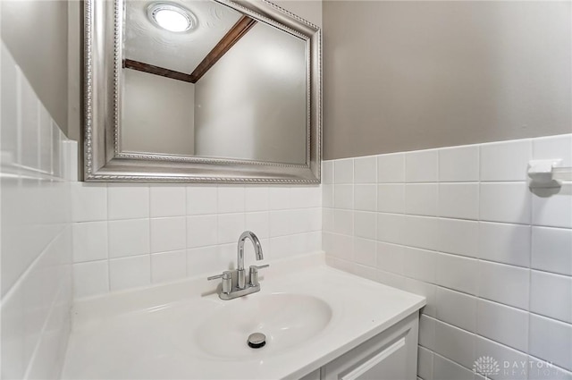 bathroom with tile walls and sink