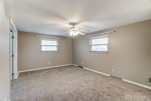 carpeted empty room with ceiling fan