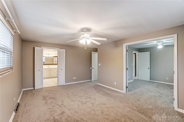 carpeted spare room with ceiling fan