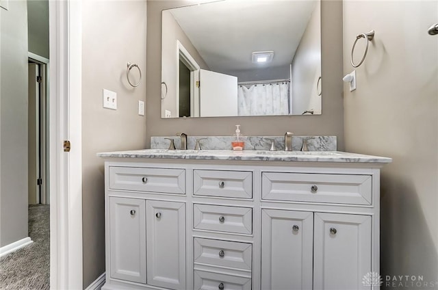 bathroom with vanity and walk in shower