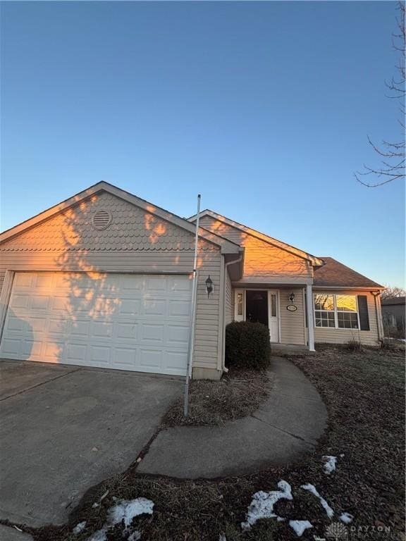 single story home featuring a garage