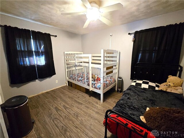 bedroom featuring wood-type flooring and ceiling fan