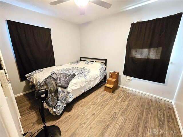 bedroom featuring wood-type flooring and ceiling fan