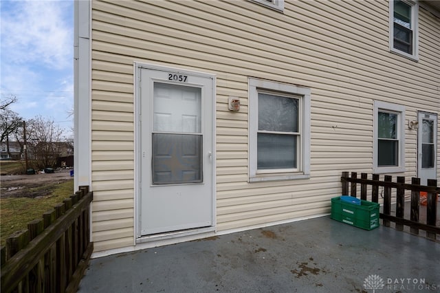 view of exterior entry featuring a patio area