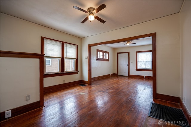 empty room featuring hardwood / wood-style flooring and ceiling fan