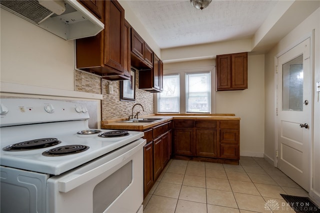 kitchen with sink, a textured ceiling, light tile patterned floors, electric range, and backsplash