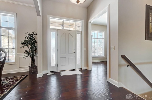 foyer entrance with dark wood-type flooring