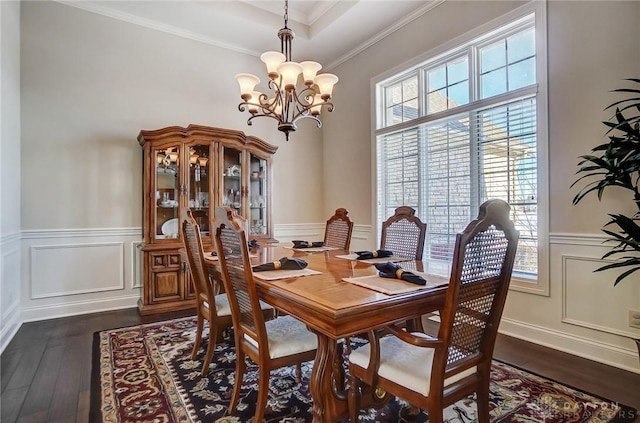 dining space with crown molding, a notable chandelier, and dark hardwood / wood-style flooring