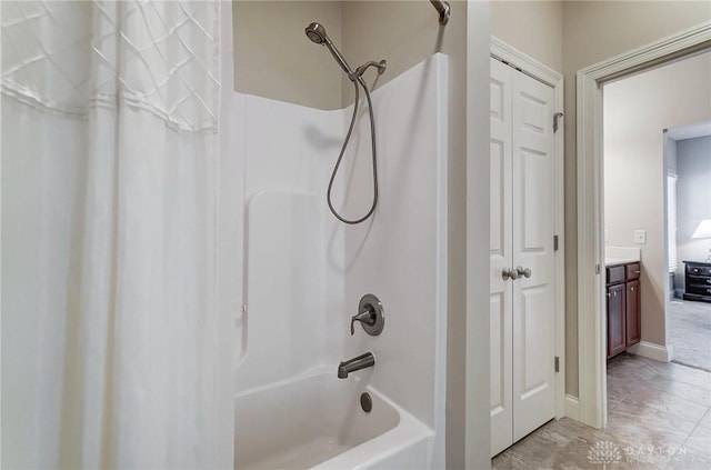 bathroom with vanity and shower / bath combo