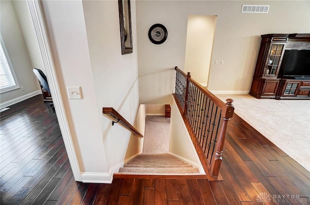 staircase featuring hardwood / wood-style flooring