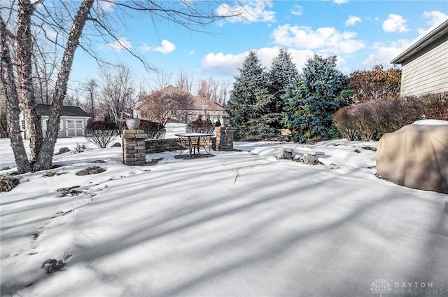 view of yard covered in snow