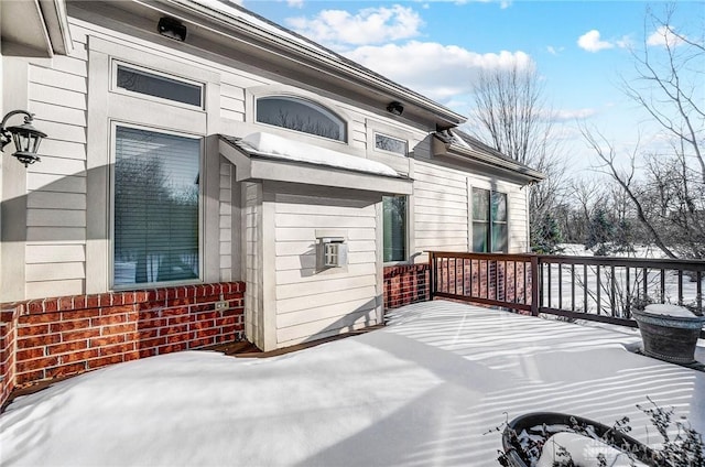 view of snow covered deck