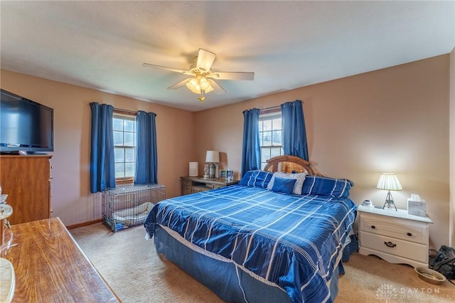 bedroom featuring ceiling fan and light colored carpet