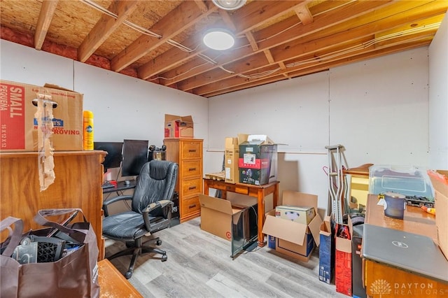 office with light hardwood / wood-style flooring