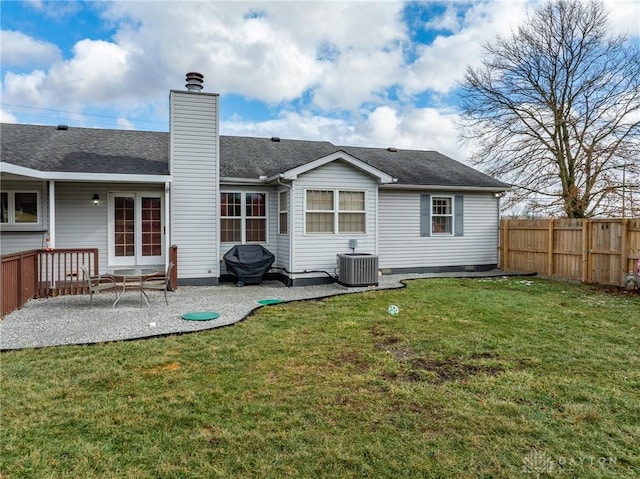 back of house with a patio, central AC, and a lawn