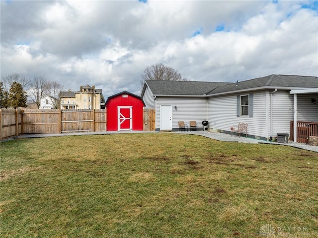 view of yard with a patio and a shed