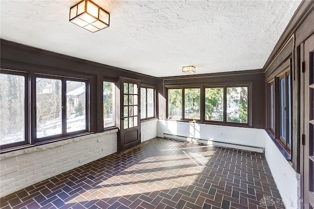 1515 Woodstock Dr, Oakwood, OH 45419 - unfurnished sunroom with a baseboard heating unit, a textured ceiling, and brick floor
