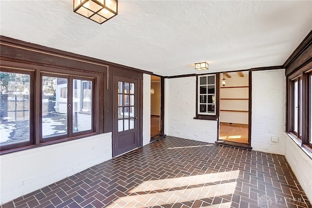 foyer with a textured ceiling