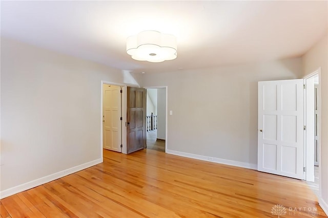 spare room with light wood-type flooring