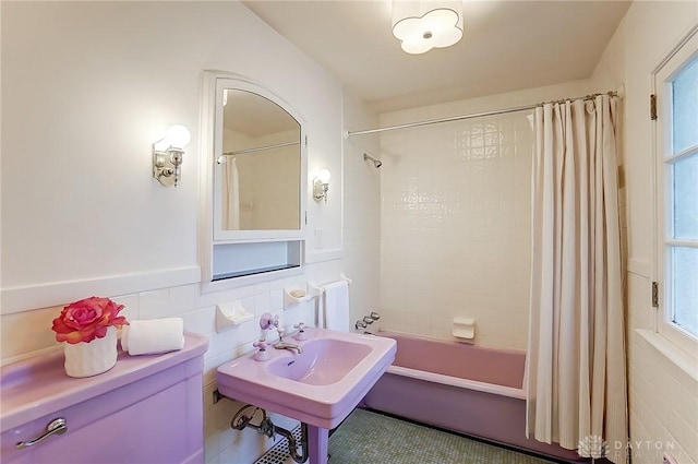 1515 Woodstock Dr, Oakwood, OH 45419 - bathroom featuring tile walls, tile patterned floors, and shower / bath combo with shower curtain