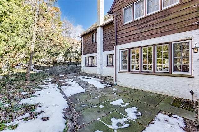 view of side of property with a patio