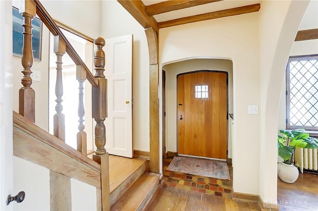 1515 Woodstock Dr, Oakwood, OH 45419 - entryway featuring hardwood / wood-style flooring, radiator, arched walkways, and stairs